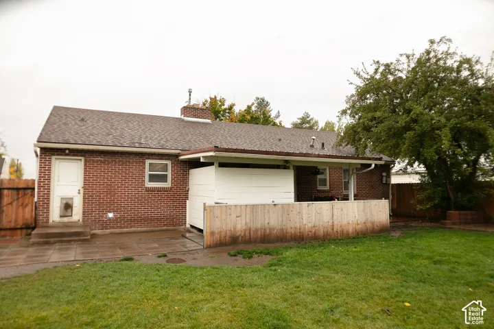 Back of home looking at covered patio