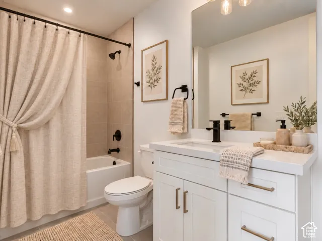 Guest Suite Bathroom featuring a white vanity cabinet with quartz countertop, undermount sink, and full-width mirror. Home is virtually staged.
