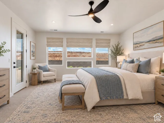 Primary Bedroom featuring expansive multi-pane windows, recessed lighting, a modern ceiling fan, and a glass-paneled exterior door to patio. Home is virtually staged