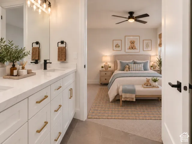 Jack-Jill bathroom featuring a double vanity with white cabinetry, quartz countertops, view is leading into bedroom 3. Home is virtually staged
