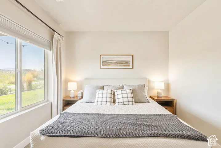 Neutral interior featuring a large picture window and natural light