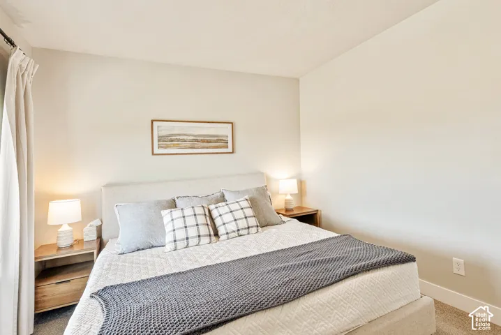 Neutral wall color and wall-to-wall carpeting