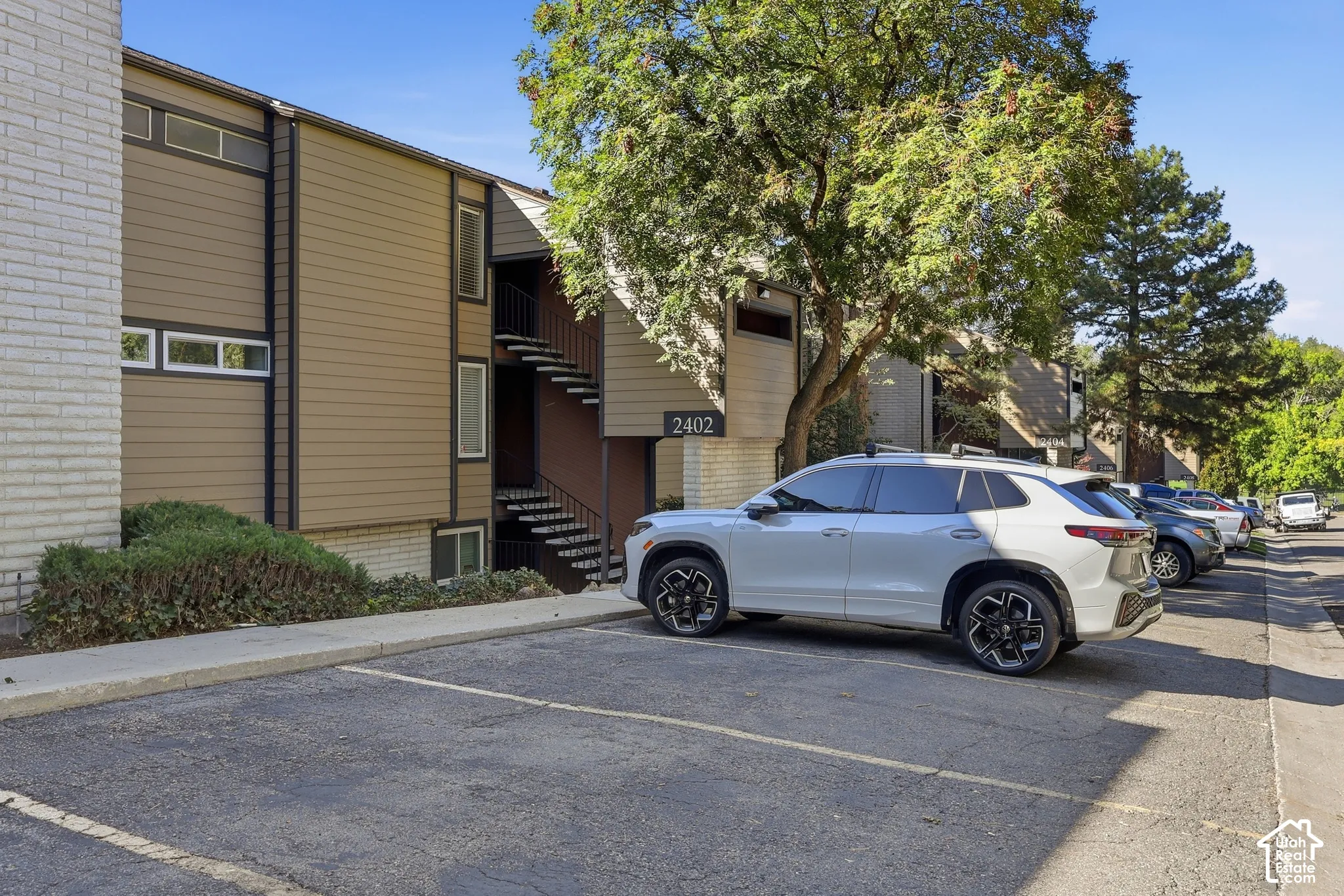 Multi-story building featuring brick and horizontal siding