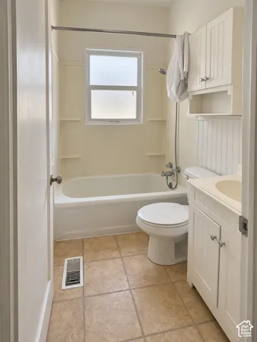 White vanity with beadboard detailing and an integrated sink