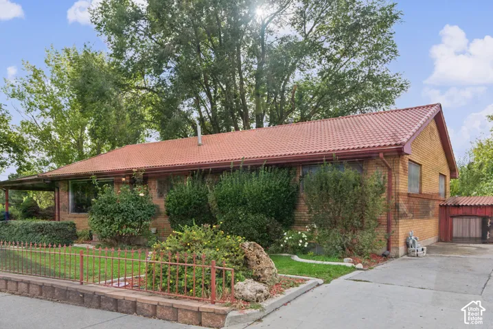 Brick exterior with a red tile roof and extended eaves