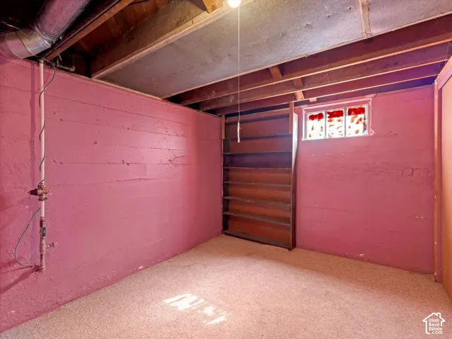 Second bedroom downstairs with good headroom, carpeting, good closet space