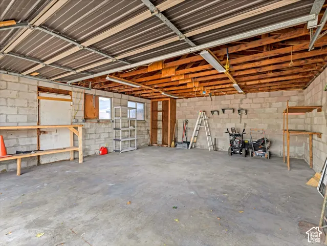 Solidly built 2-car block garage with man-door and windows.