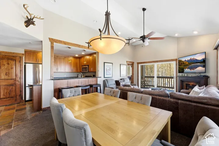 Open-concept living space with a dining area, kitchen pass-through, and living room