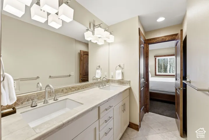 Dual vanity with undermount sinks, chrome fixtures, and a light-toned countertop