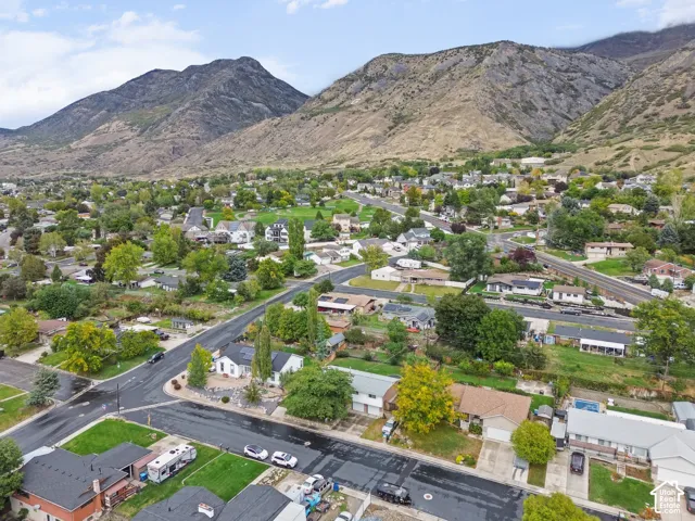 Aerial perspective featuring mountain scenery and established neighborhood landscaping