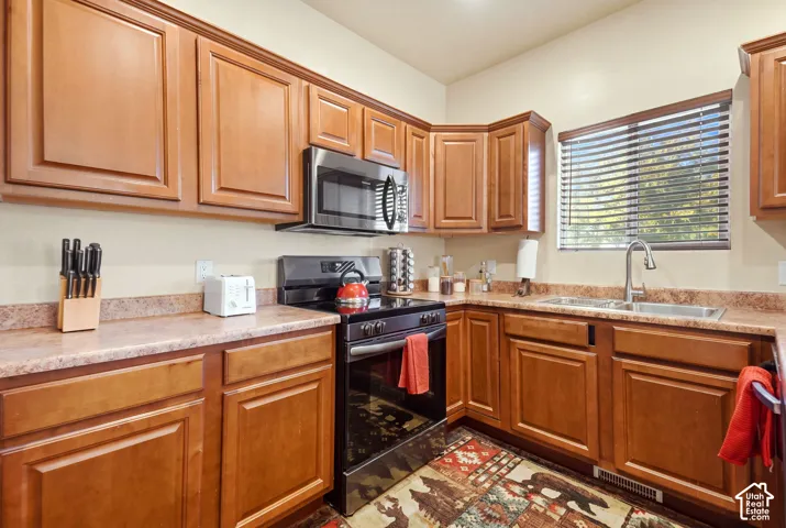 Spacious open kitchen with ample countertopps and cupboards.