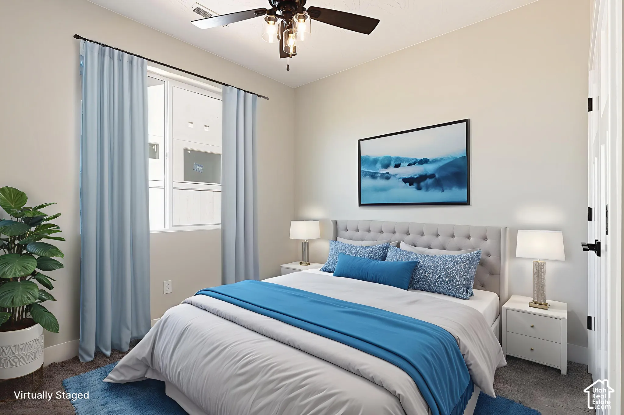 Bedroom featuring neutral wall paint, carpeting, a ceiling fan with integrated light fixture, and a window