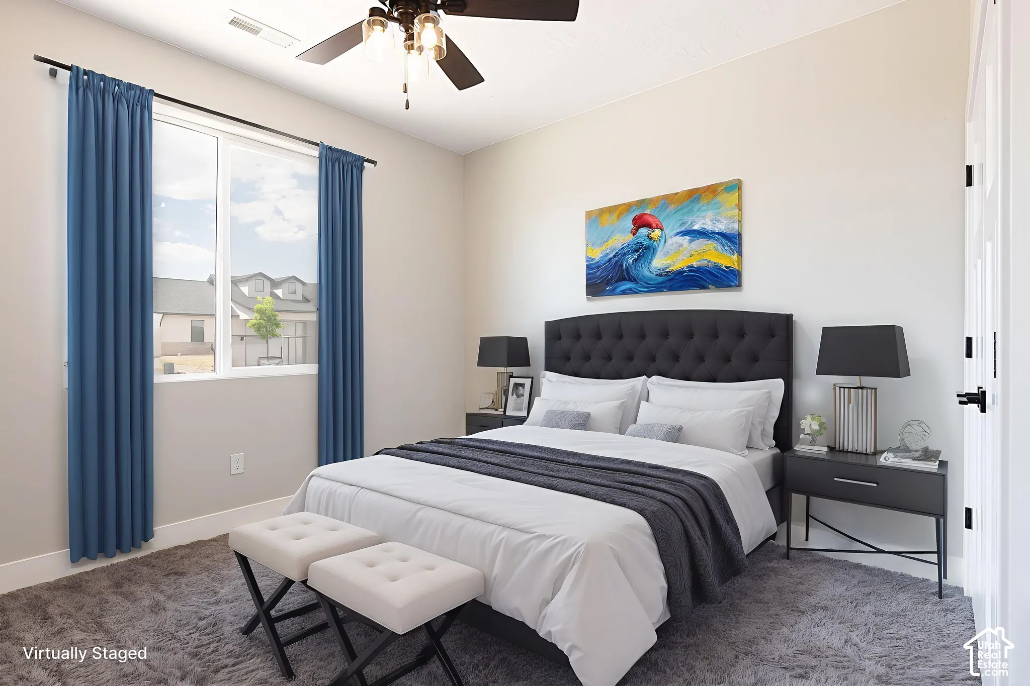 Neutral-toned interior space featuring a multi-blade ceiling fan with light fixture and a wide window with dark metal curtain rod