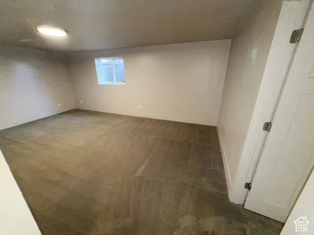Recessed lighting, window with blinds, light-toned walls, and wood-finish flooring