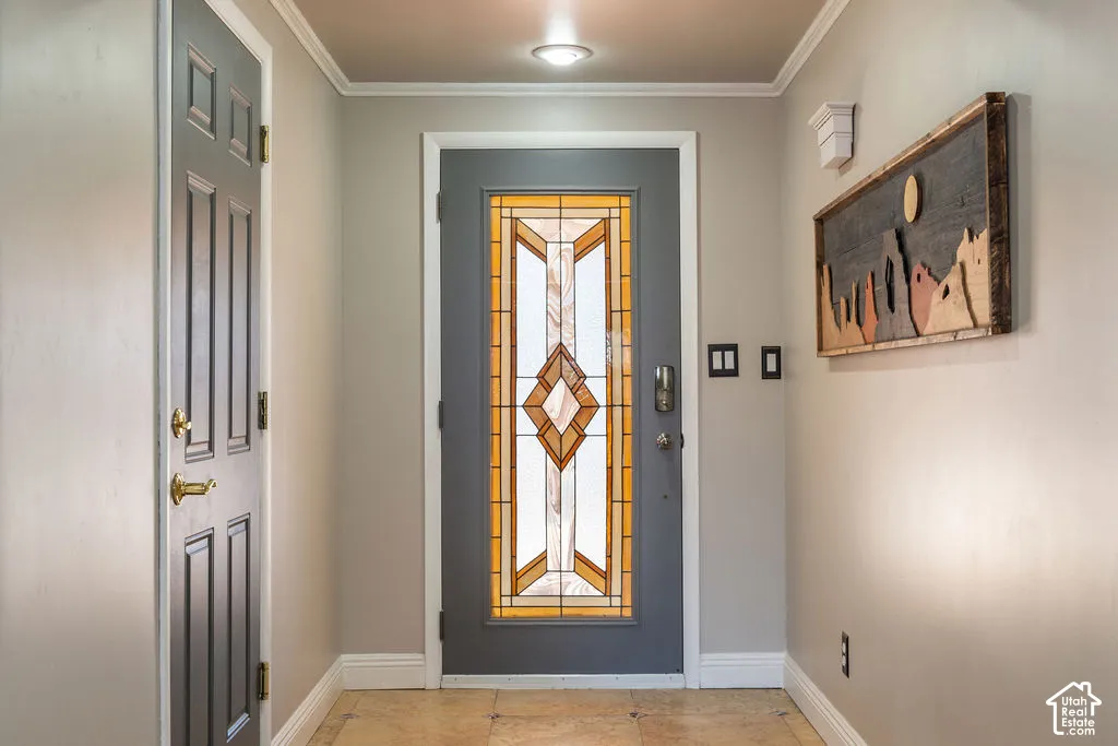 Entry with a leaded glass door, panel doors, and neutral wall paint