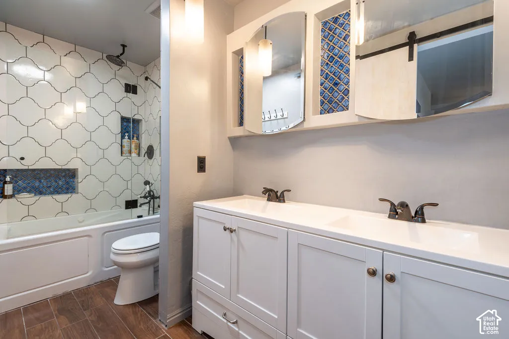 Double vanity with integrated sinks and bronze-finish hardware