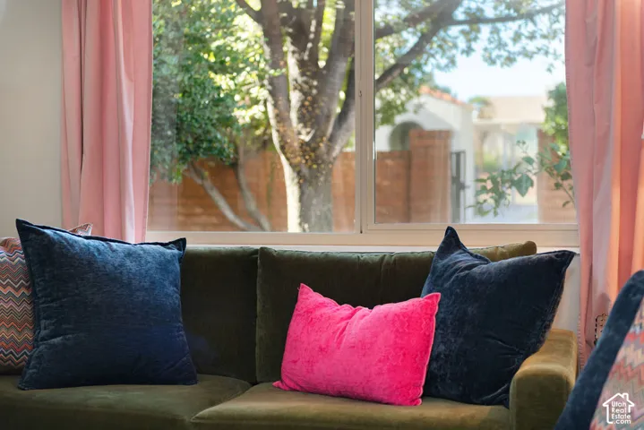 Window with white frame and pink drapes