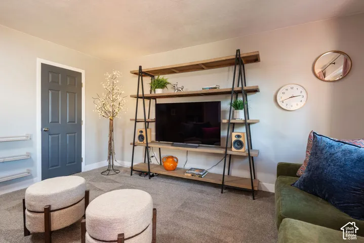 Built-in shelving unit with wood-finish shelves and dark metal frame