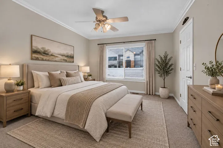 Room featuring wall-to-wall carpeting, crown molding, a multi-blade ceiling fan with integrated lighting, and a sliding window