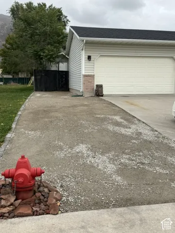 Vinyl siding exterior, multi-car garage, and stone masonry accent RV PARKING