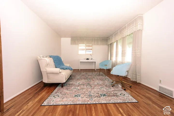 Wood-finish flooring, multi-pane windows, and neutral interior wall finishes