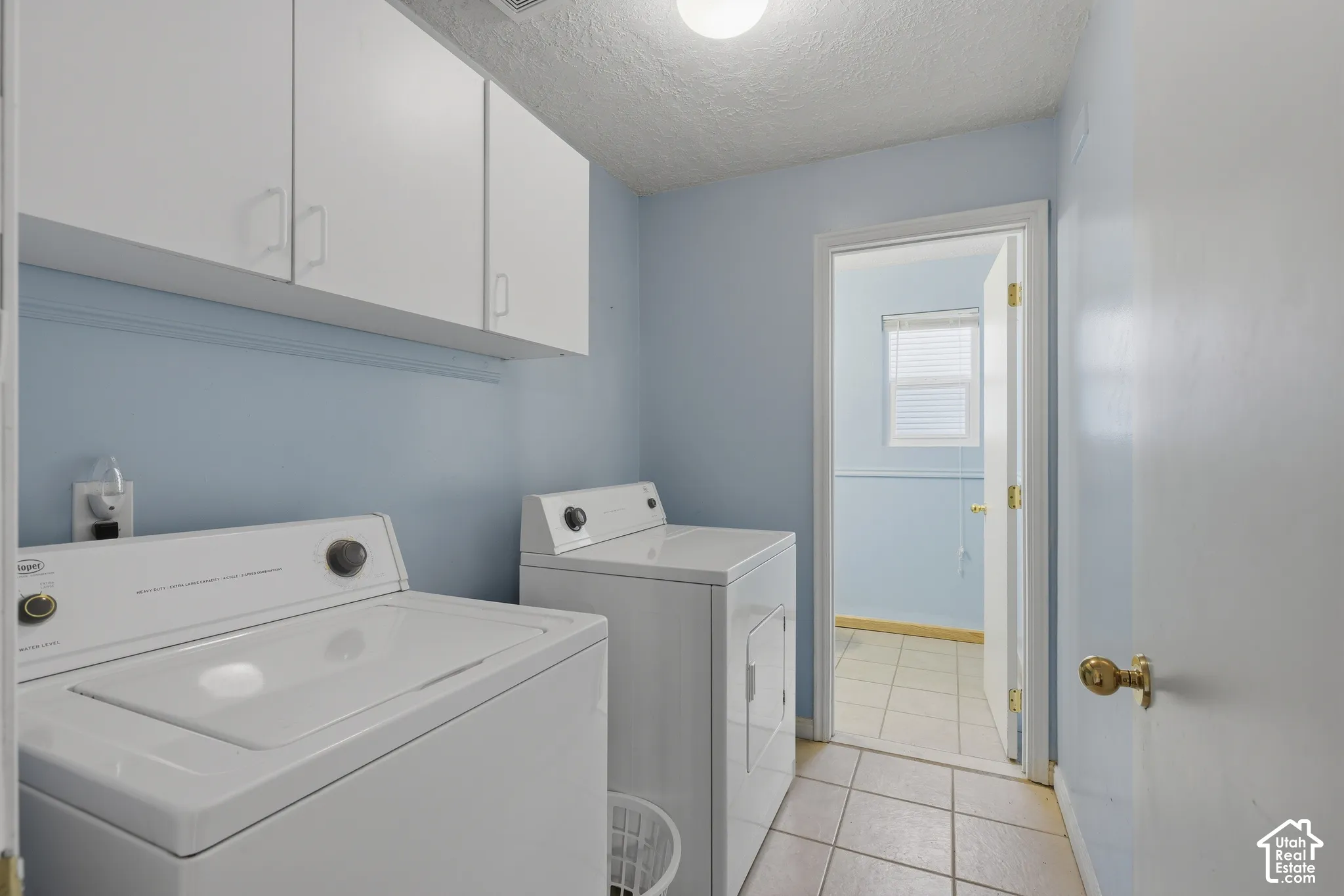 Laundry room with included washer and dryer