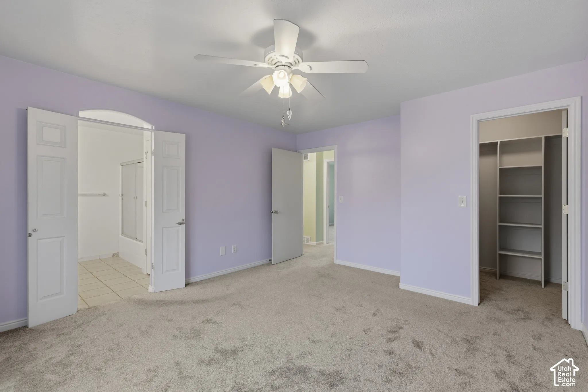 Primary bedroom with walk-in closet and en-suite bath