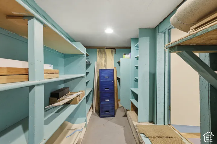 Lower level storage room with built-in shelves.  Bonus Sq Ft, not included in the listed sq ft