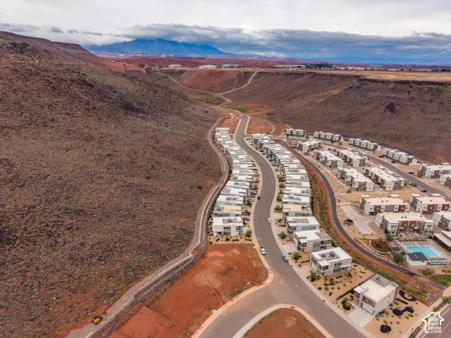 Aerial perspective featuring a desert landscape, mountain scenery, and proximity to natural rock formations