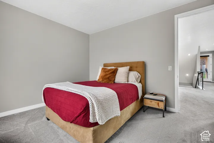 Neutral wall palette featuring textured carpeting and light-toned interior paint