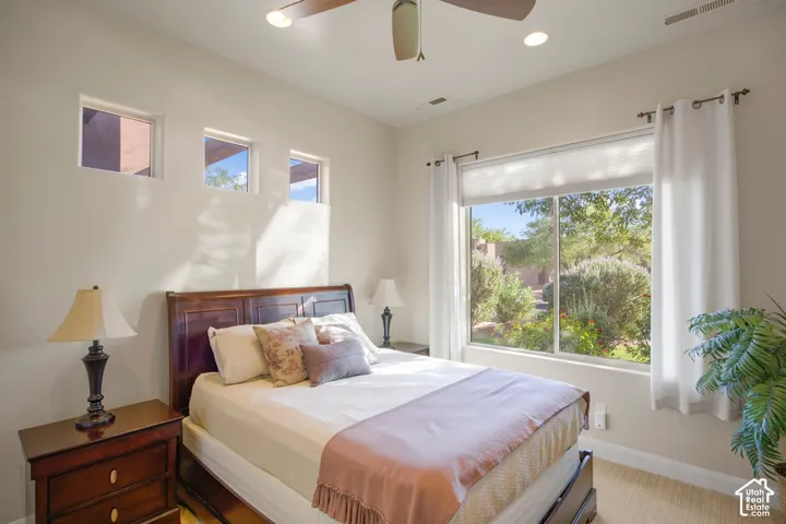 Recessed lighting, ceiling fan, large picture window, high windows, and light wall finishes