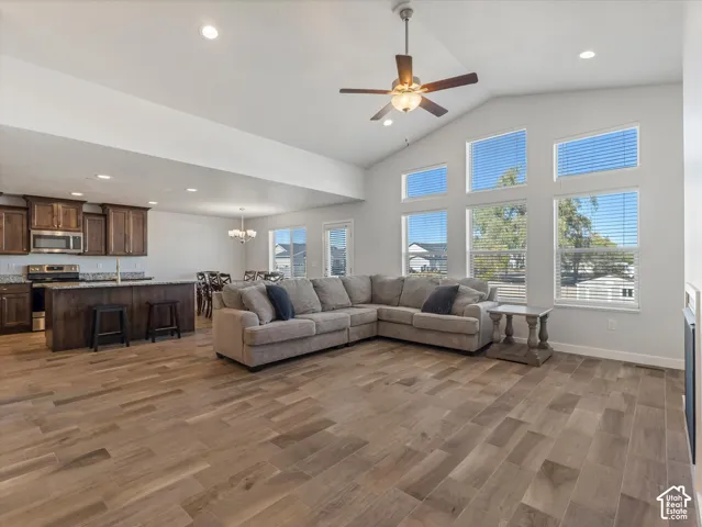Vaulted ceilings, wood-finish tile flooring, recessed lighting and expansive multi-pane windows