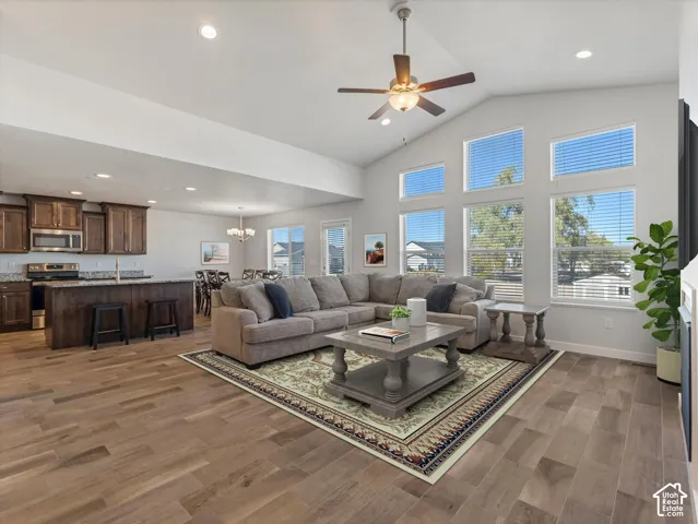 Vaulted ceilings, wood-finish tile flooring, recessed lighting and expansive multi-pane windows