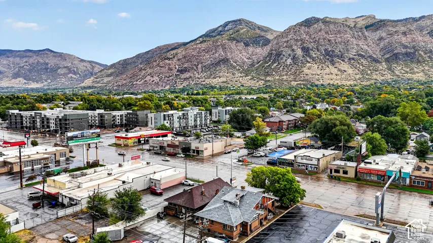 Aerial perspective showcasing an urban setting with a mountain backdrop