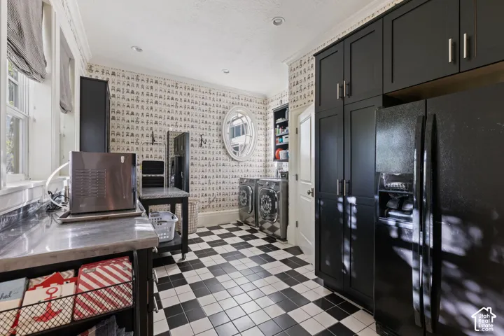 Utility space featuring full-height matte black cabinetry, checkerboard tile flooring, a built-in oval window, and recessed ceiling lighting