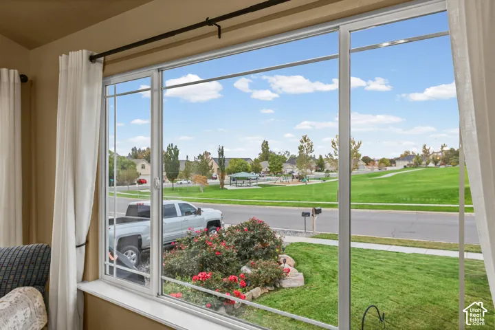 Large picture window featuring white frames and a broad sill