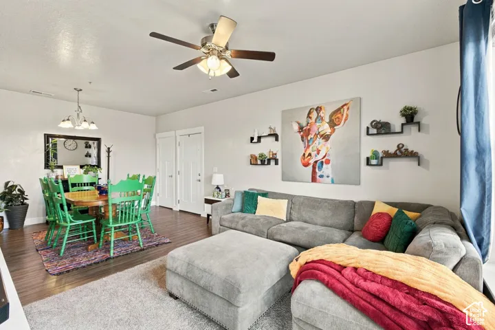 Recessed lighting, wood-finish flooring, and a ceiling fan with integrated light fixture