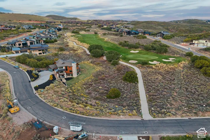 Property situated on a paved street with a curving driveway