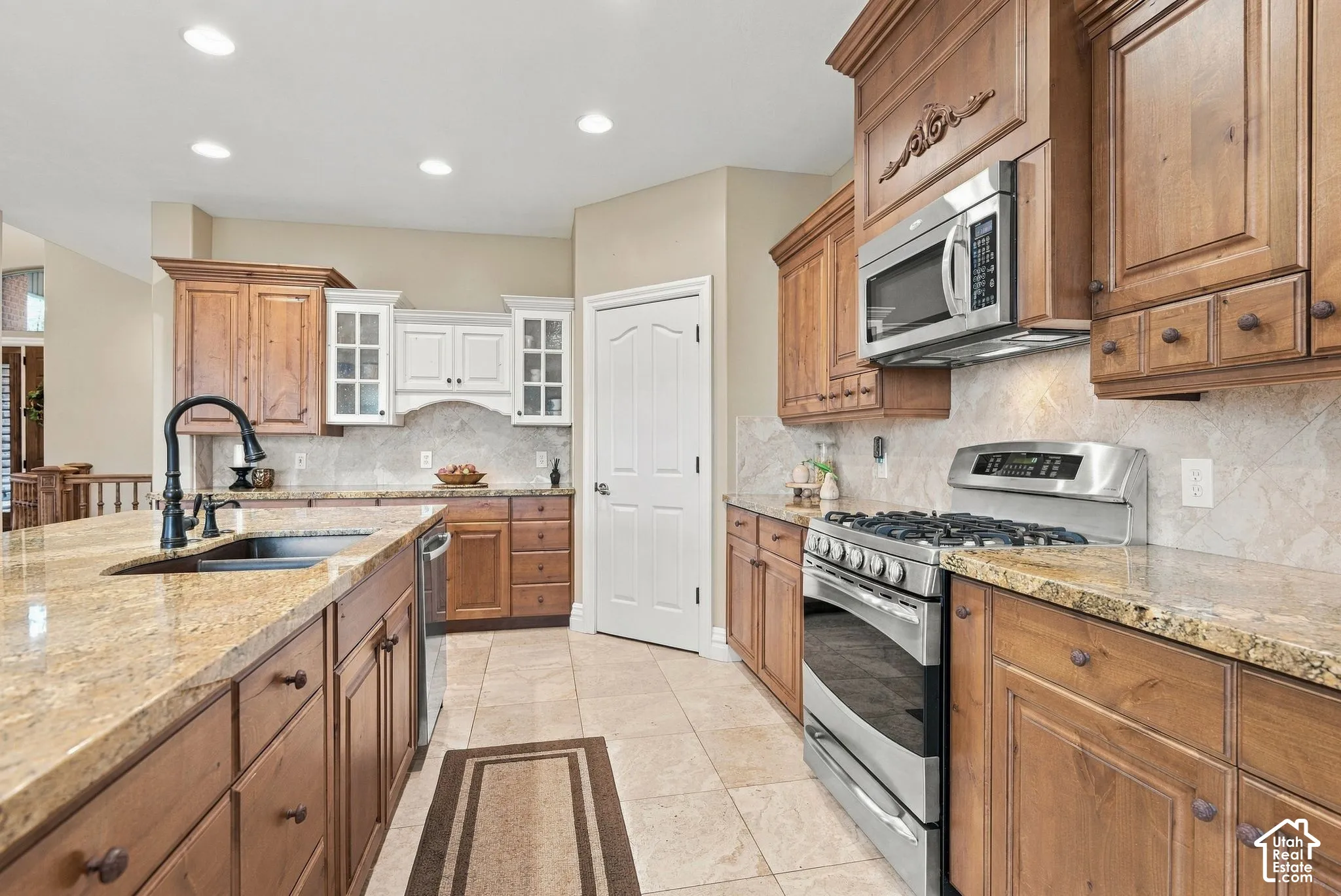Spacious Walk-In Pantry, Custom Cabinetry with White China Cabinet, Spice Rack Pullout and Cabinet Pullouts