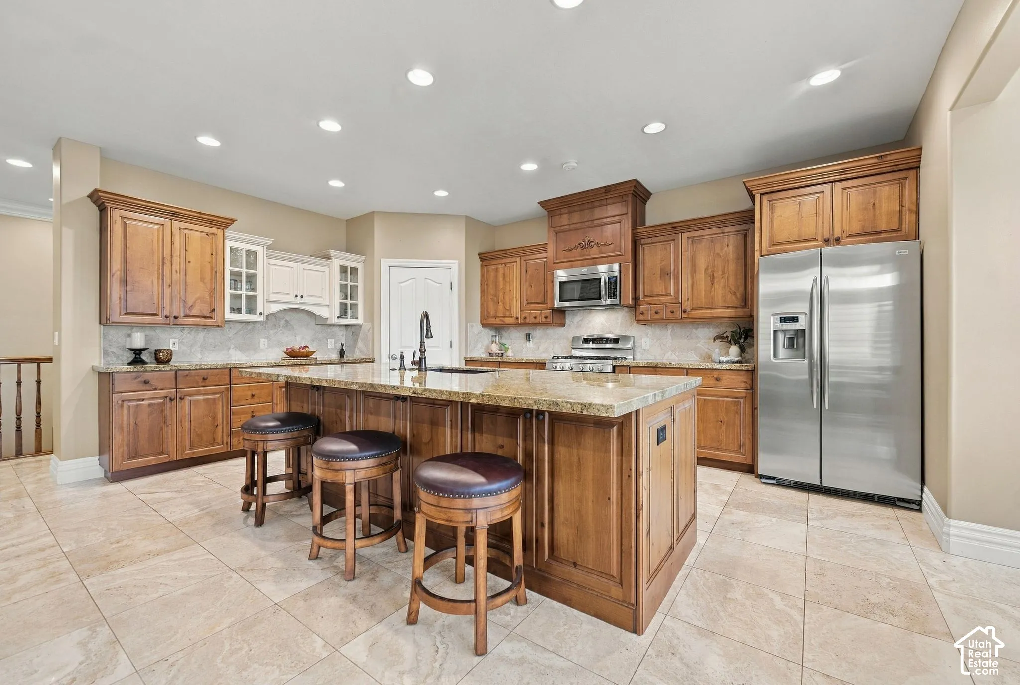 Large Gourmet Kitchen with Custom Cabinetry and Gleaming Stainless Steel Appliances, Double Gas Ovens