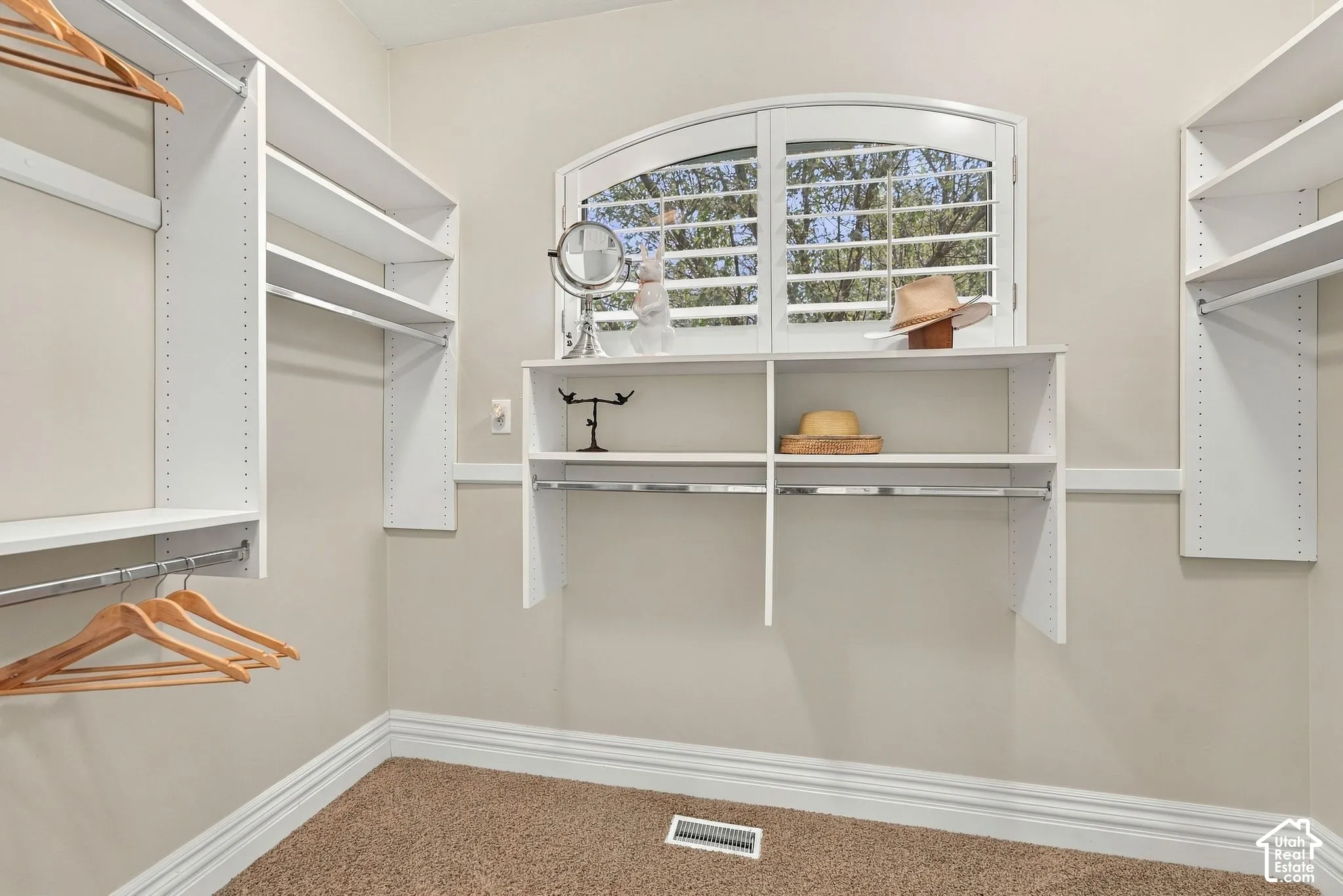 Spacious Primary Walk-in Closet is Filled with Natural Light