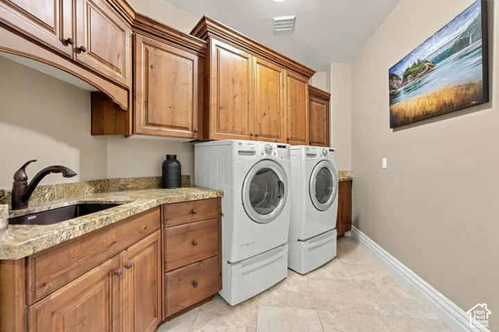 Laundry Room on Main Level has Scrub Sink, Granite, and Custom Cabinetry