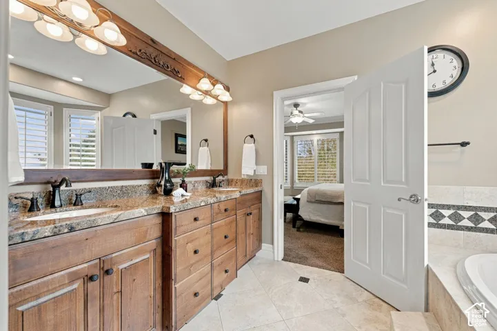 Primary Bathroom boasts Double Sinks in Granite, and Custom Cabinetry