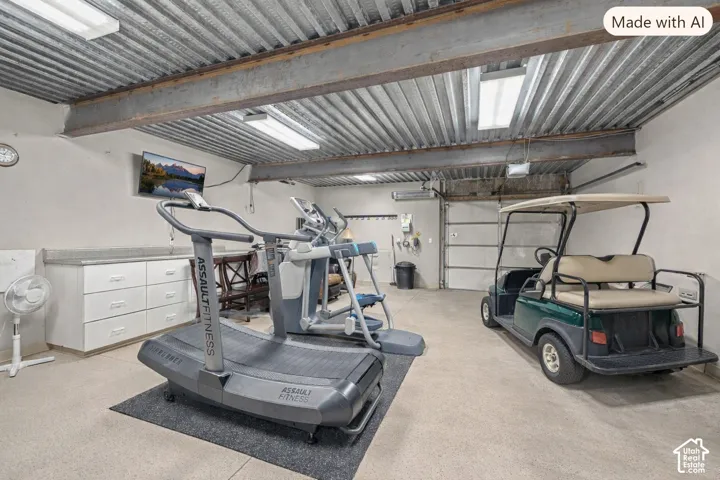 Amazing 28'X22' MAN CAVE, GOLF CART, ATV, EXERCISE ROOM, WORKSHOP, STORAGE ROOM! Pathway from Driveway to this Garage Door for easy Golf Cart, ATV storing! Golf Course One Block South!  Digitally removed furniture and added Golf Cart.