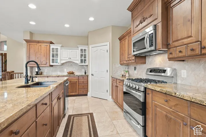 Spacious Walk-In Pantry, Custom Cabinetry with White China Cabinet, Spice Rack Pullout and Cabinet Pullouts