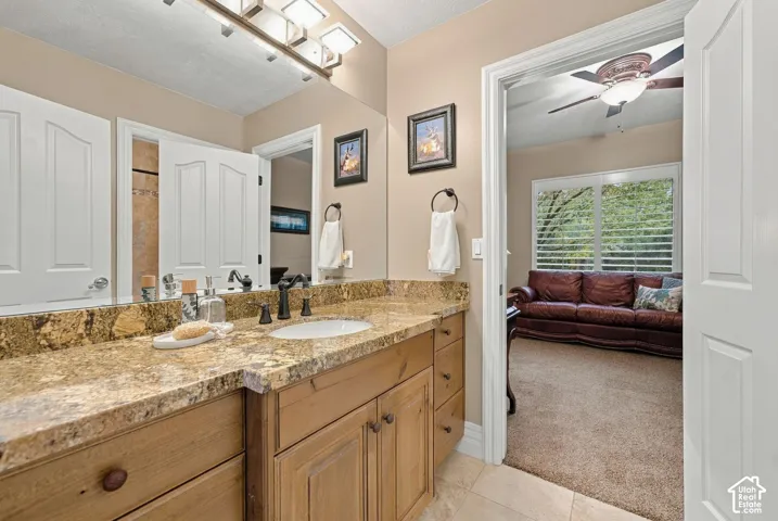 Jack and Jill Bathroom with Granite, Custom Cabinetry and Separate room with Tub/Tile Shower and Toilet, to accommodate multiple people getting ready.
