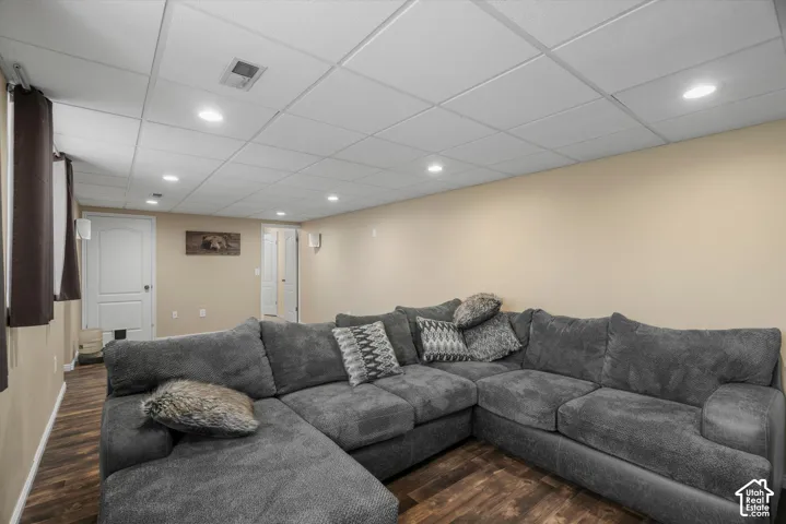 Wood-finish flooring, recessed lighting, and a drop ceiling