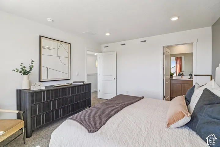 Neutral-toned room featuring recessed lighting, plush carpeting, and two panel-style interior doors