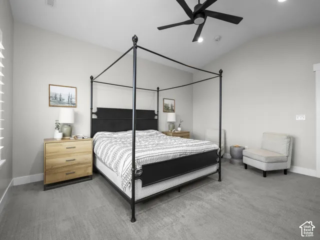 Neutral-toned room with high ceilings, recessed lighting, and a modern black ceiling fan