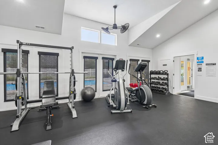 Vaulted ceilings, high-contrast black and white interior finish, expansive glass panels, and rubberized flooring